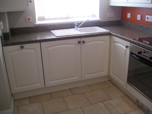 The same cream kitchen, third view