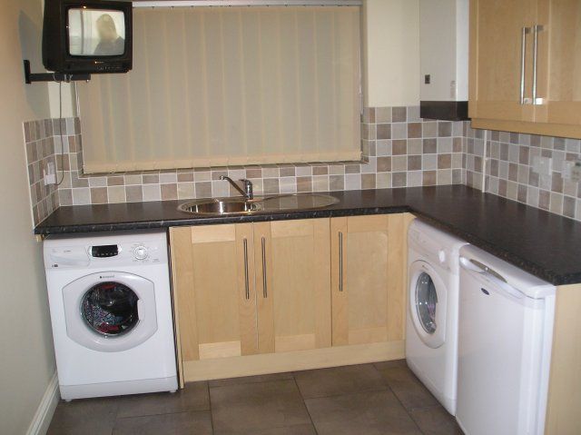 The same pale wood kitchen, second view