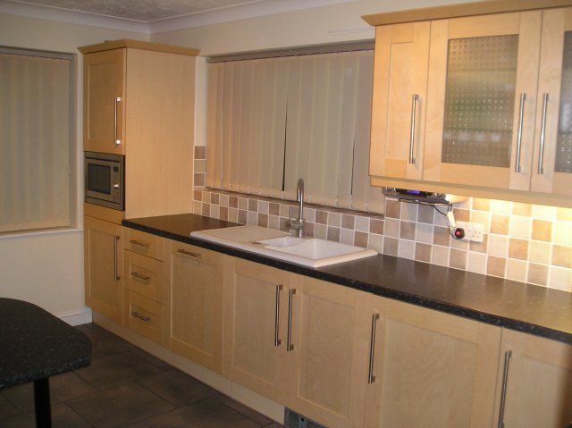 The same pale wood kitchen, third view